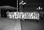 Protesters Holding "No U.S. Military Aid in Latin America" Banner
